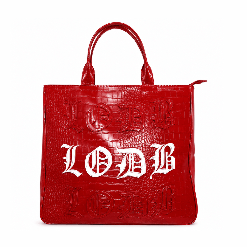 Vibrant red vegan alligator leather utility bag with raised white Gothic text