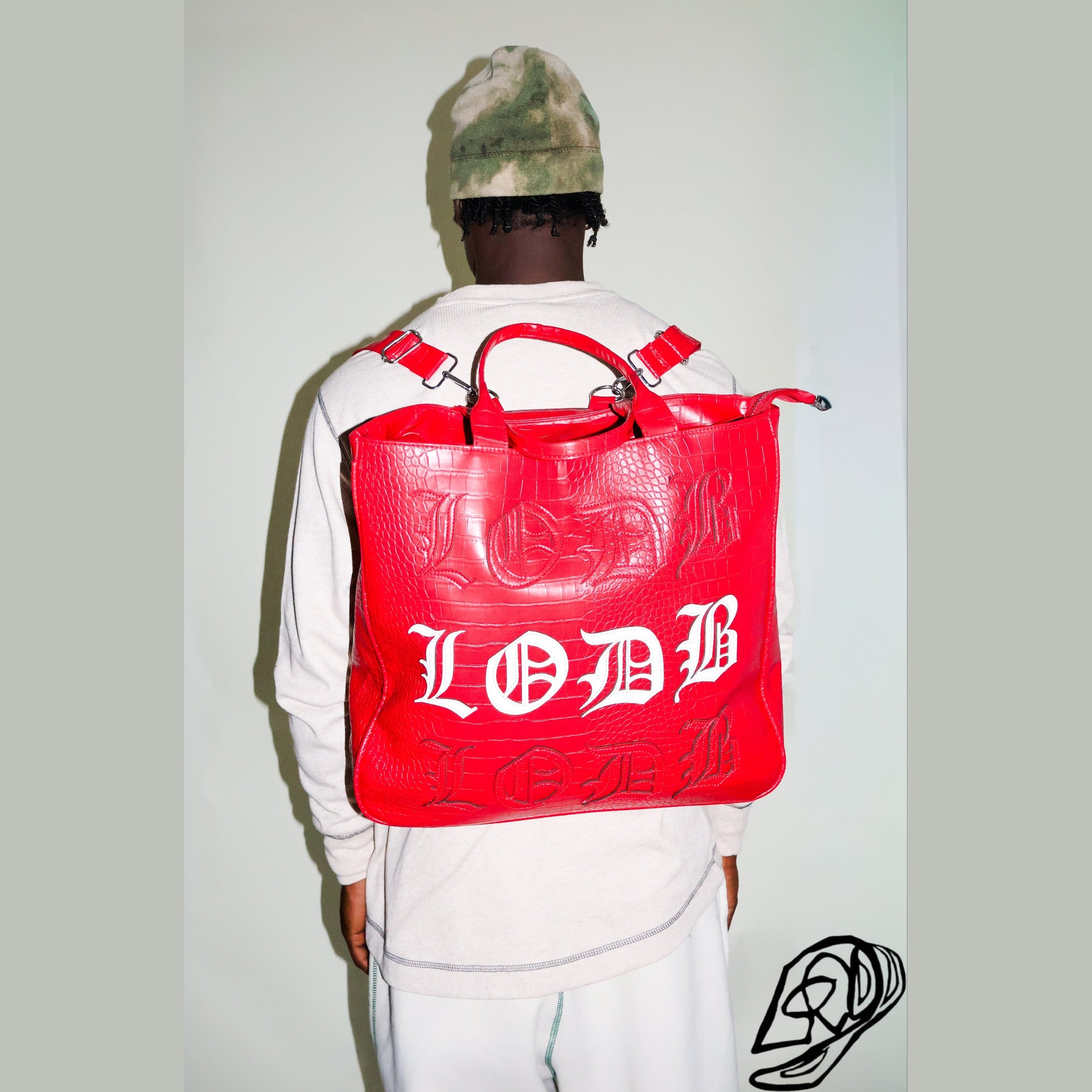 Red crocodile-texture utility backpack with adjustable straps and embossed white LODB logo