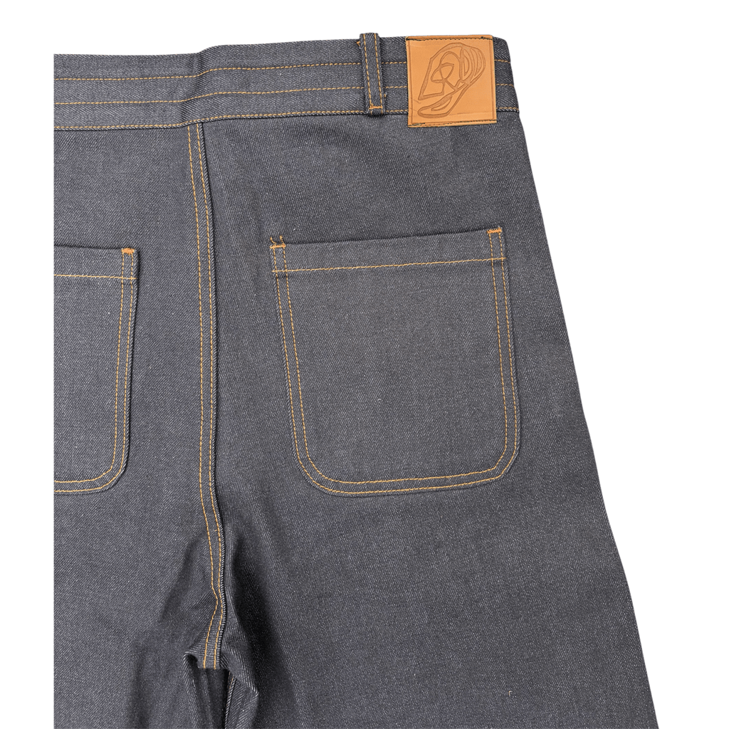 LODB raw denim shorts leather tag detail and twill texture close-up